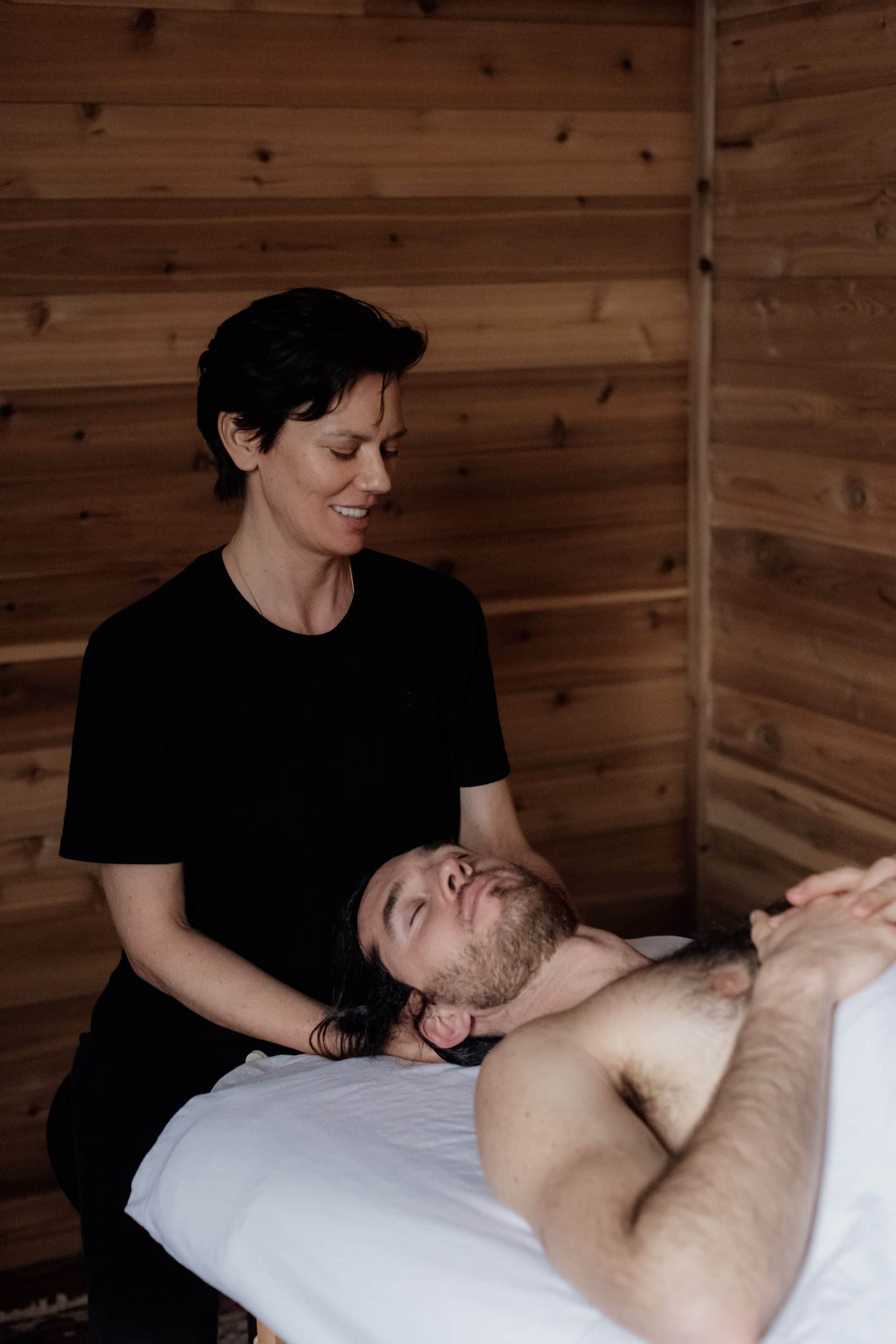 Therapist providing holistic massage at our Victoria wellness clinic