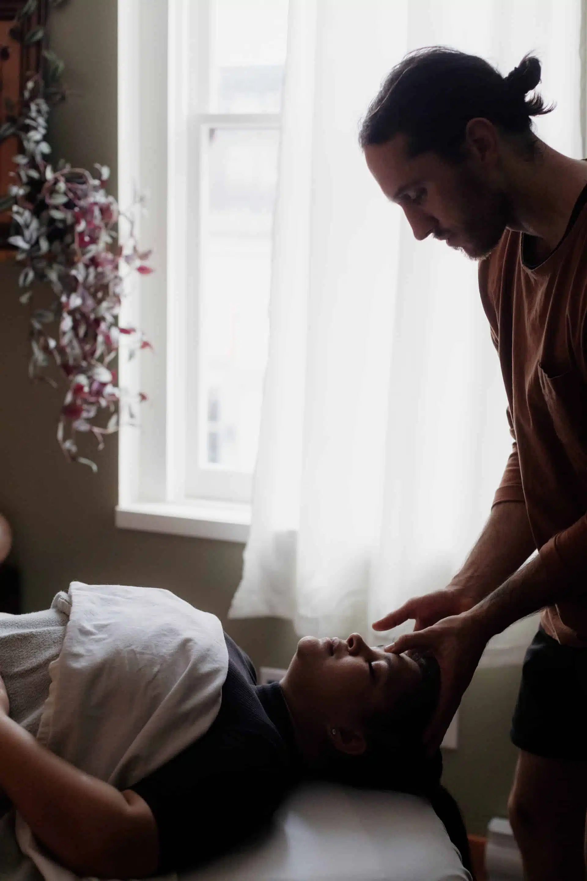 Head Acupuncture for Stress Relief in Victoria - Expert Therapeutic Techniques. Acupuncture expert in Victoria preparing to administer head acupuncture therapy for stress relief and relaxation.
