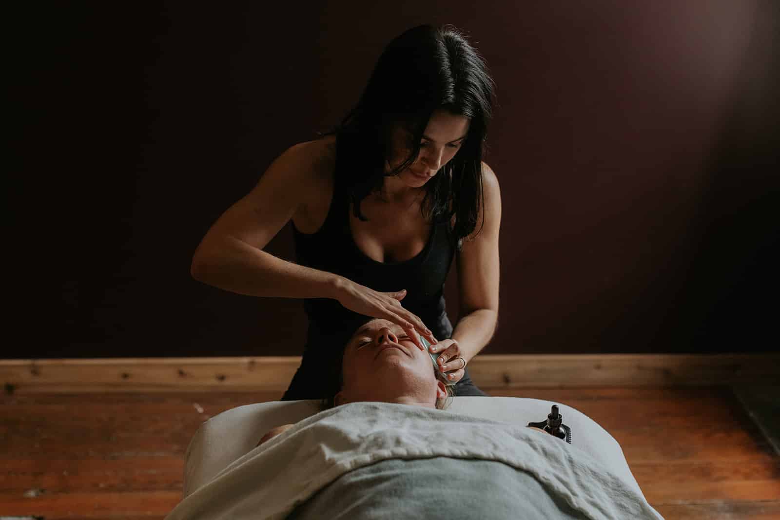 Massage therapist performing deep tissue massage in Victoria, BC