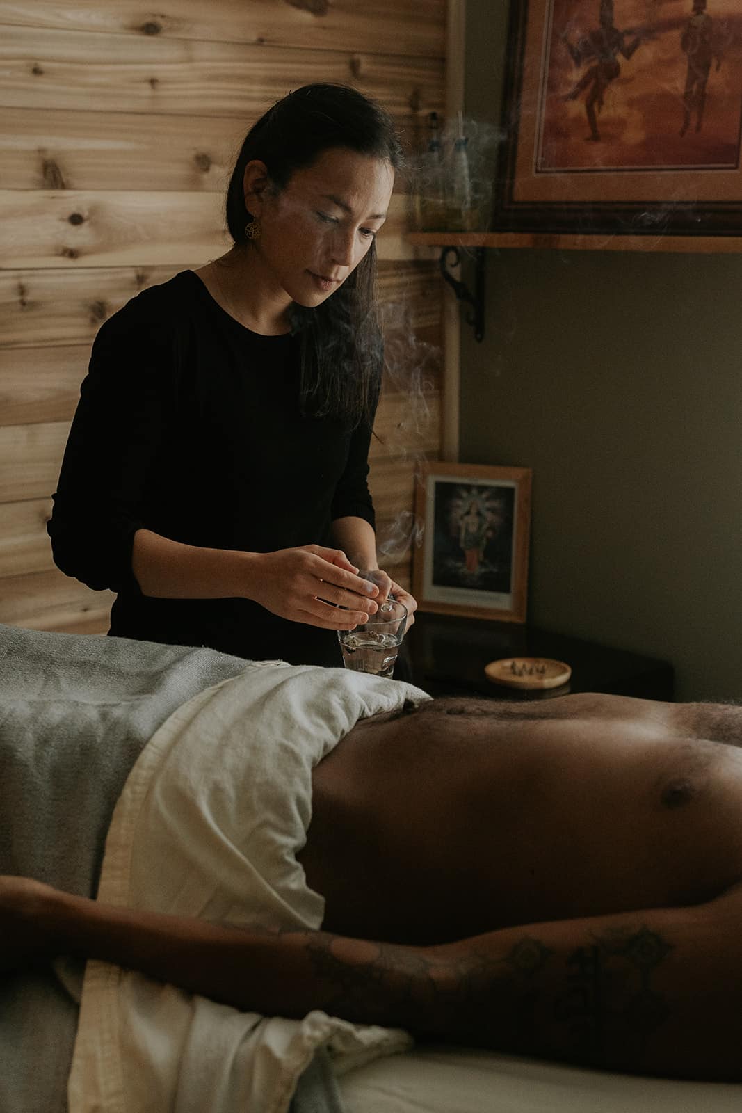 Female acupuncturist performing a treatment session